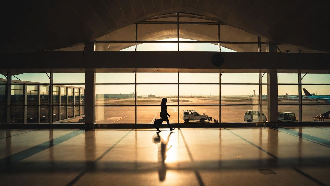 European passport next to financial documents and a calculator showing capital gains tax computations