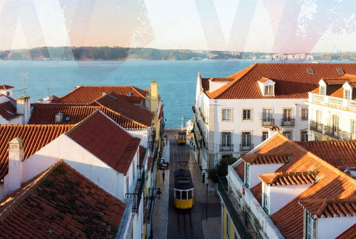 Lisbon Portugal waterfront with traditional architecture representing IFICI tax incentive regime replacing NHR for new residents